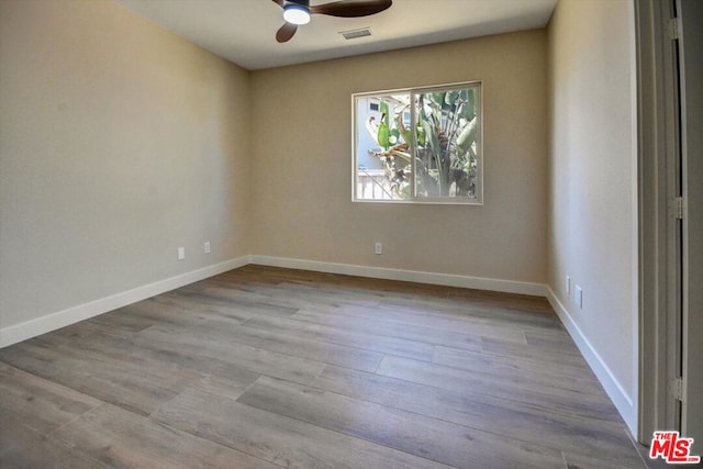 unfurnished room with ceiling fan and light hardwood / wood-style floors