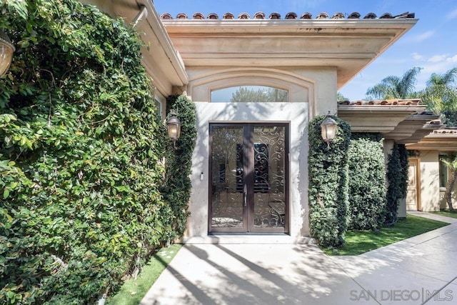 entrance to property featuring french doors