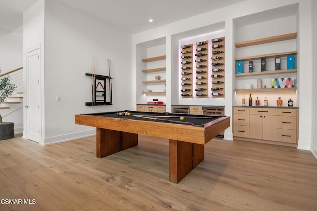 rec room with built in shelves, light hardwood / wood-style floors, and billiards