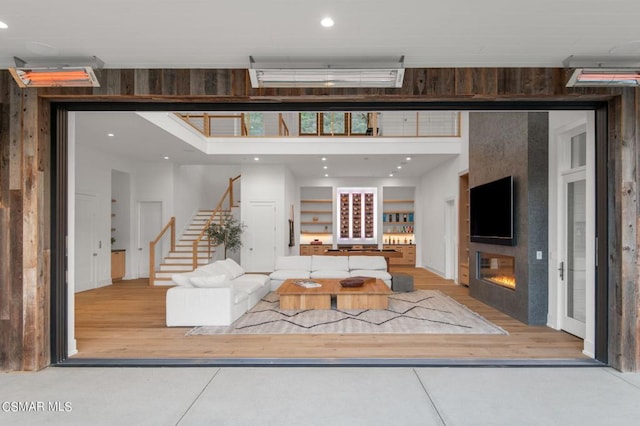 living room featuring a fireplace and wood-type flooring