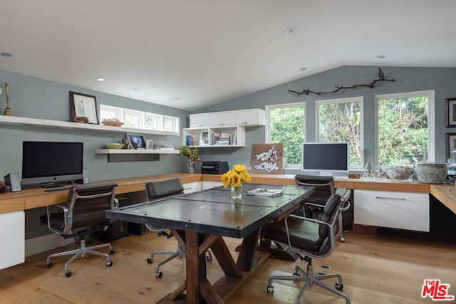 office area with lofted ceiling, light hardwood / wood-style flooring, and plenty of natural light