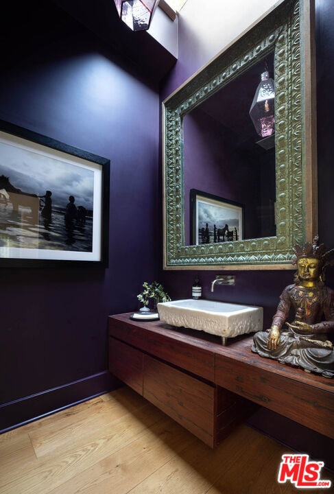 bathroom with vanity and hardwood / wood-style floors