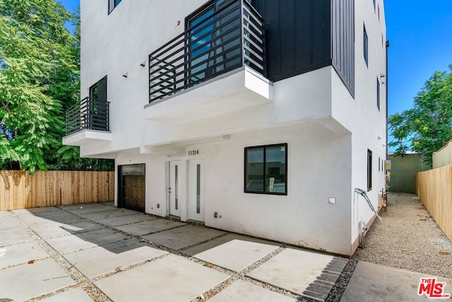 exterior space with a patio area and a balcony