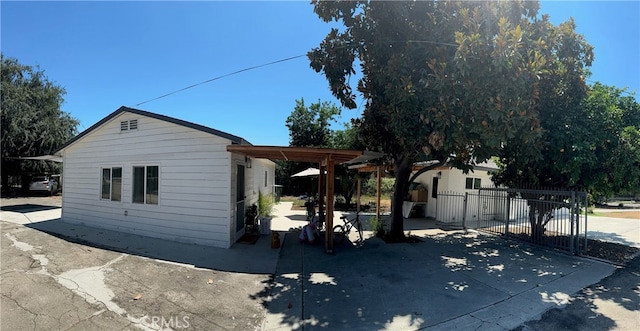 view of side of property with a patio