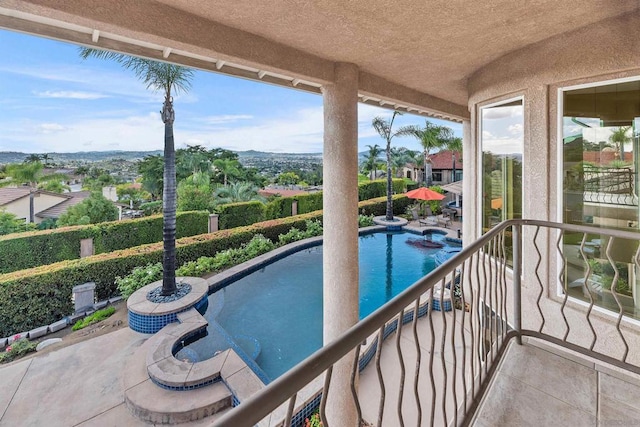 view of swimming pool with a patio