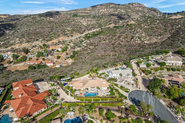 birds eye view of property with a mountain view