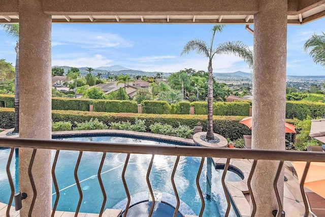 balcony featuring a mountain view