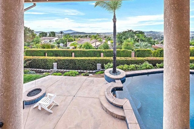 view of patio / terrace with a mountain view