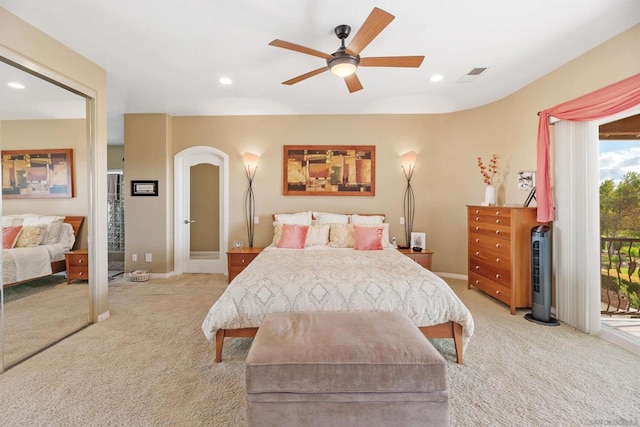 carpeted bedroom with access to outside and ceiling fan