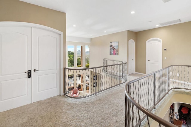 hallway with light carpet