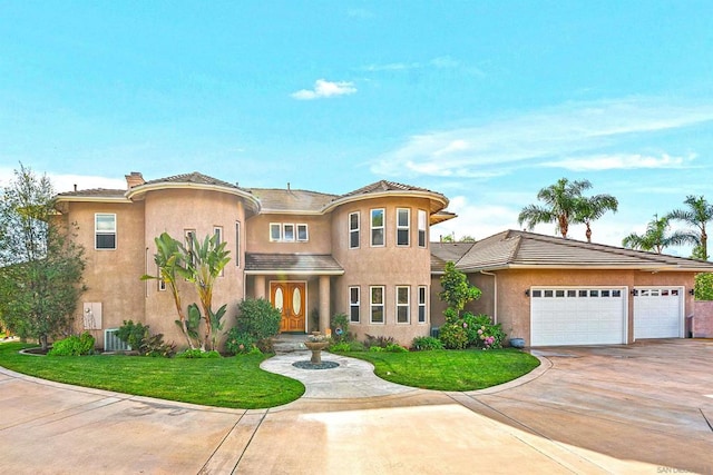 view of front facade featuring a front lawn and a garage