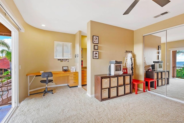 home office with carpet and ceiling fan