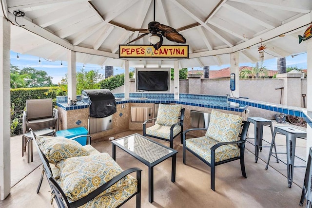 view of patio with a gazebo, ceiling fan, and area for grilling