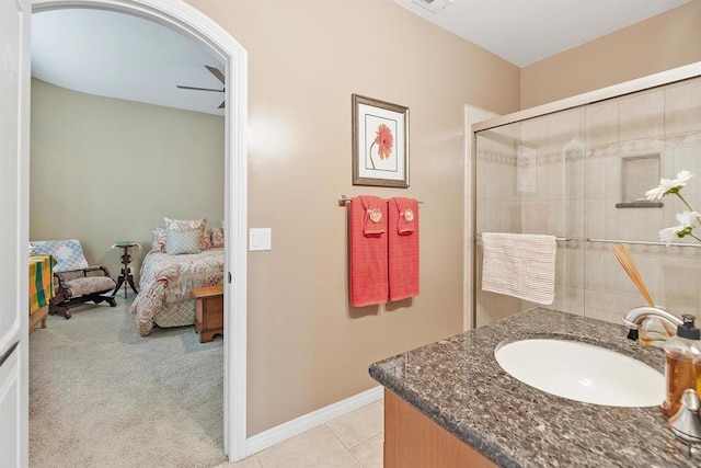 bathroom featuring vanity, ceiling fan, tile patterned floors, and a shower with shower door