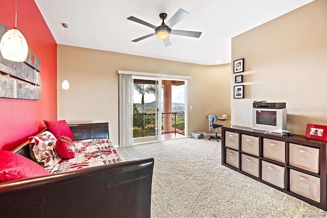 bedroom featuring access to outside, carpet flooring, and ceiling fan