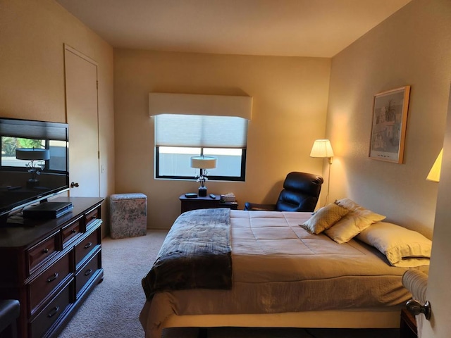 bedroom featuring light colored carpet