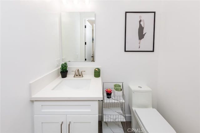 bathroom with vanity and toilet