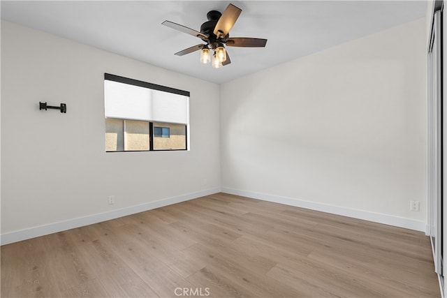 empty room featuring light hardwood / wood-style floors and ceiling fan