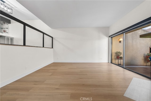 spare room featuring light wood-type flooring