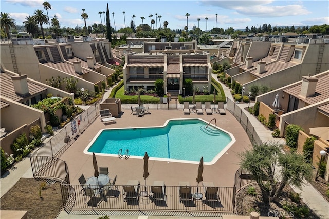 view of swimming pool featuring a patio area