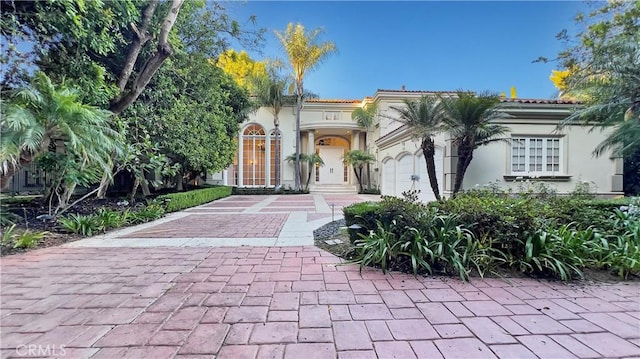 mediterranean / spanish-style house featuring a garage