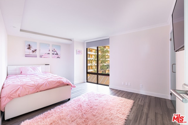 bedroom with expansive windows, access to exterior, dark wood-type flooring, and ornamental molding