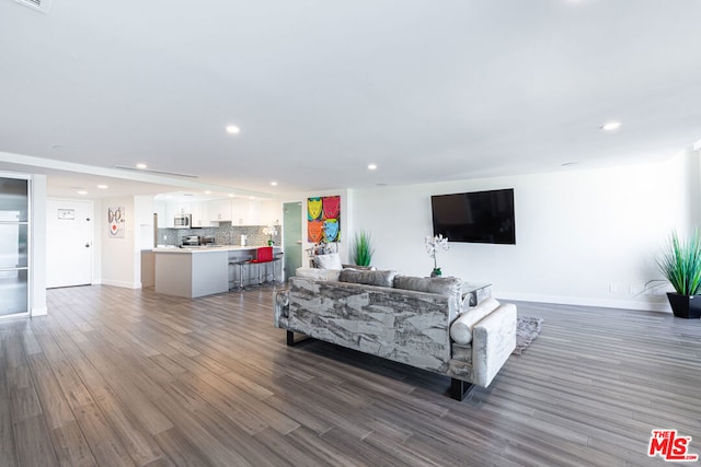 living room featuring dark wood-type flooring