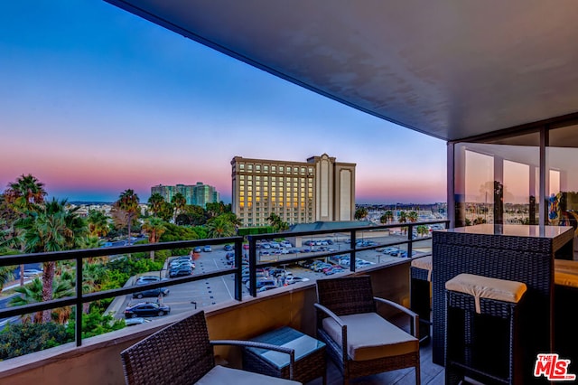 view of balcony at dusk