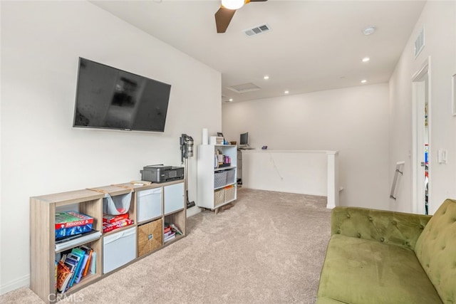 rec room featuring ceiling fan and light colored carpet