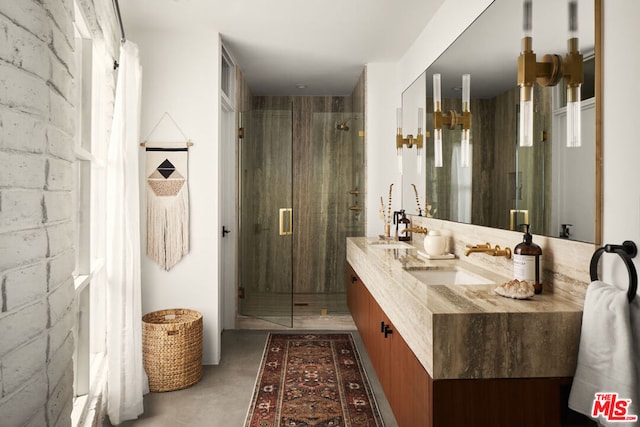 bathroom featuring vanity, an enclosed shower, and concrete flooring