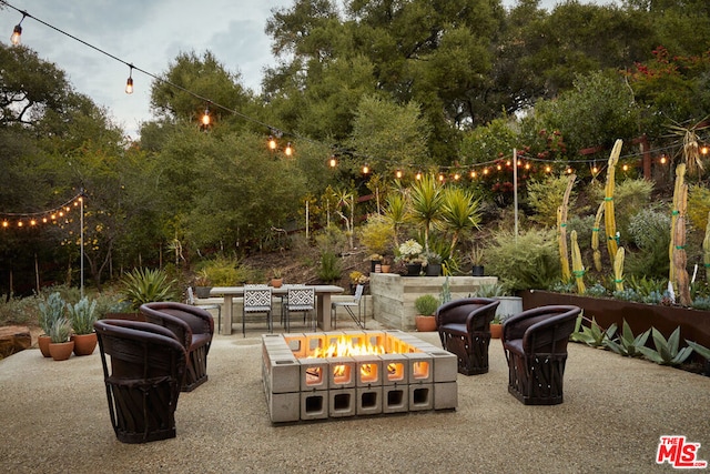 view of patio / terrace featuring a fire pit