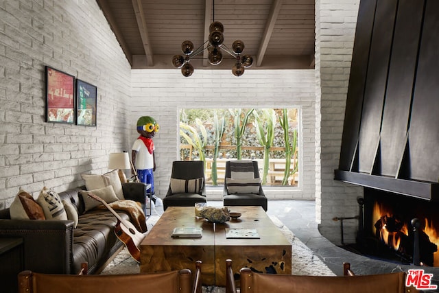 living room featuring a fireplace, beam ceiling, wood ceiling, and brick wall