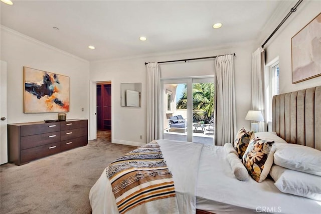 carpeted bedroom with access to outside, a spacious closet, and crown molding