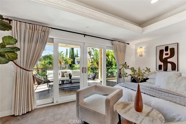 carpeted bedroom with access to outside, a raised ceiling, crown molding, and french doors