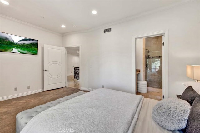 carpeted bedroom with connected bathroom and ornamental molding