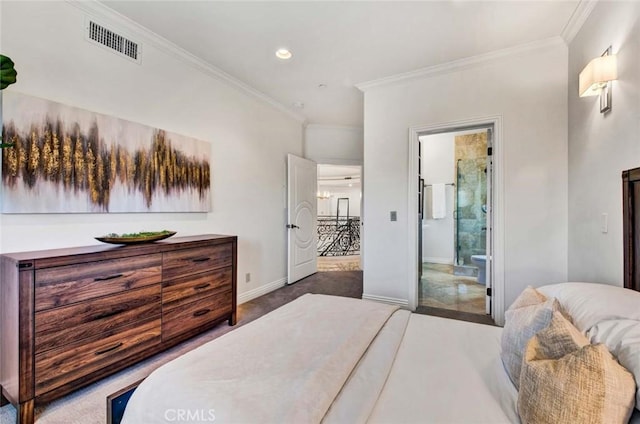 bedroom featuring dark colored carpet, crown molding, and connected bathroom