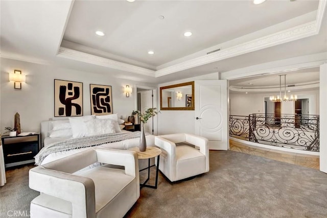 bedroom featuring carpet and a tray ceiling