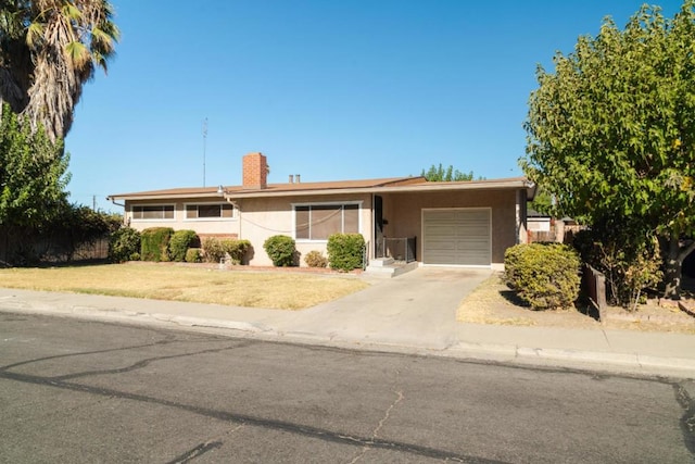 ranch-style home featuring a garage