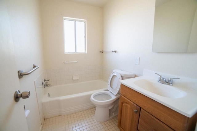 bathroom featuring a washtub, toilet, and vanity