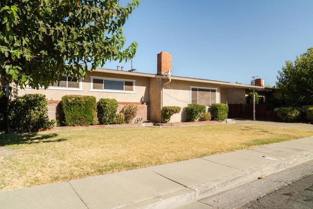 single story home with a front yard