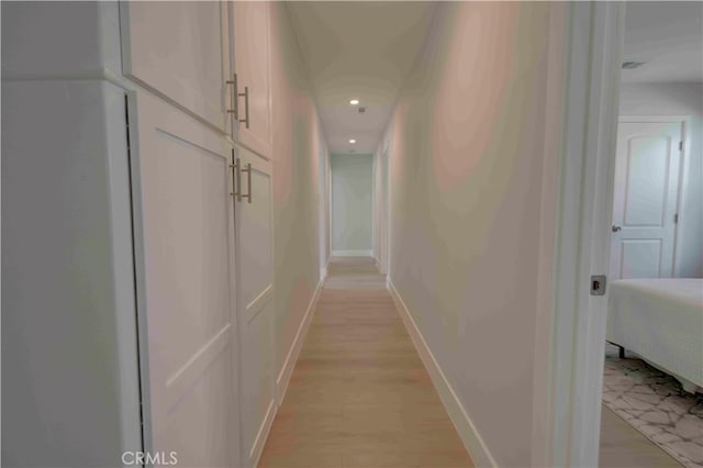 corridor featuring light hardwood / wood-style floors