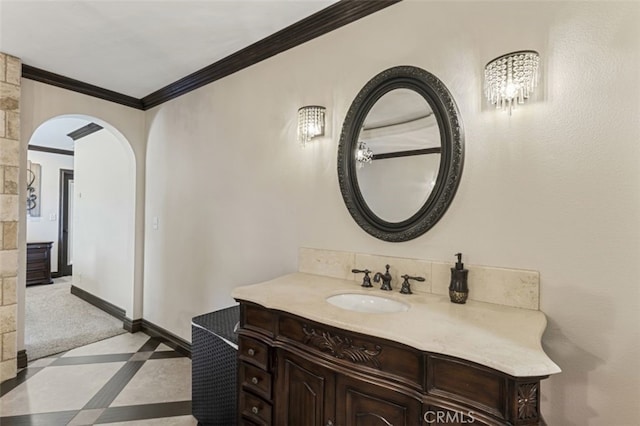 bathroom featuring ornamental molding and vanity