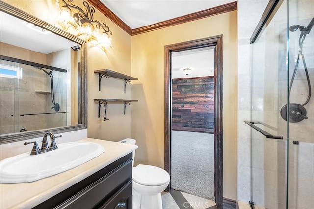 bathroom with walk in shower, vanity, toilet, and ornamental molding