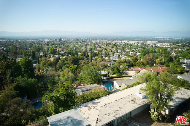 birds eye view of property featuring a mountain view