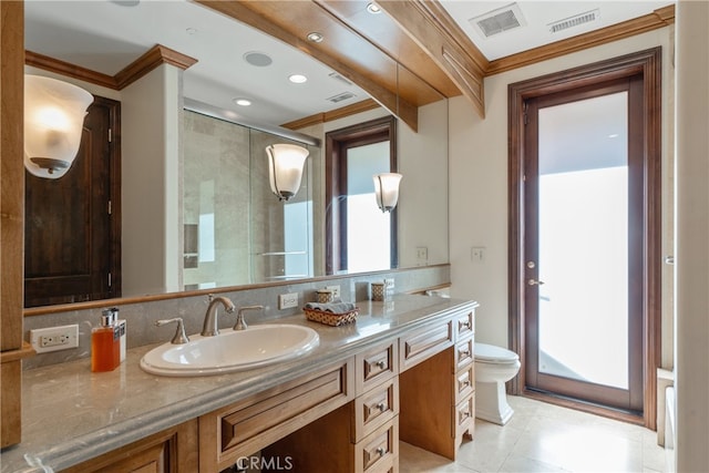 bathroom featuring vanity, toilet, visible vents, and a stall shower