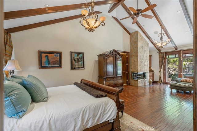 bedroom with a chandelier, beam ceiling, high vaulted ceiling, and wood finished floors