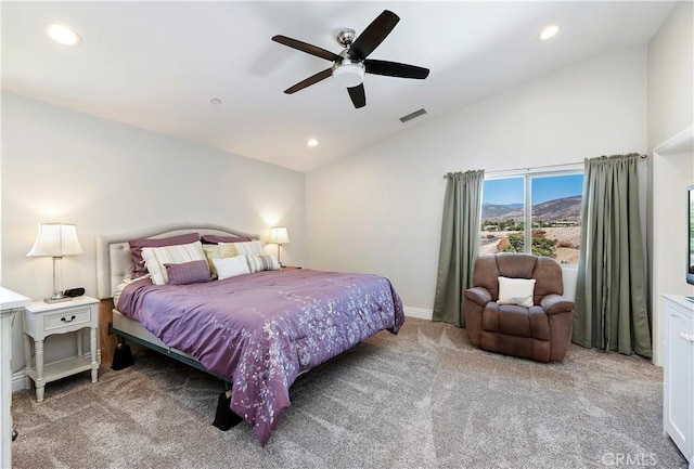 carpeted bedroom with ceiling fan and lofted ceiling