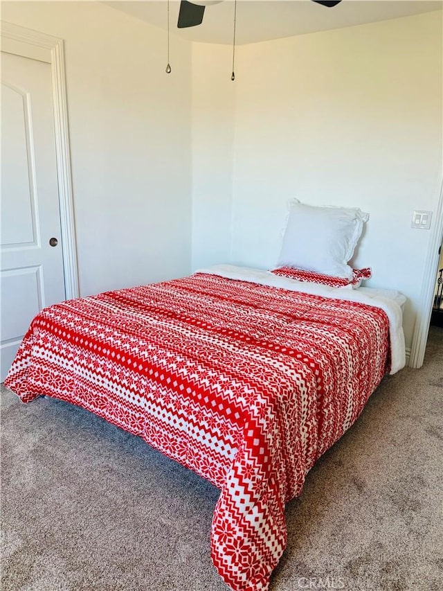 bedroom with ceiling fan and carpet floors