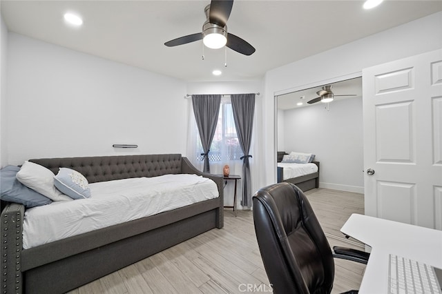 bedroom featuring light hardwood / wood-style floors and ceiling fan