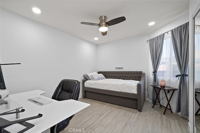 bedroom with light wood-type flooring and ceiling fan